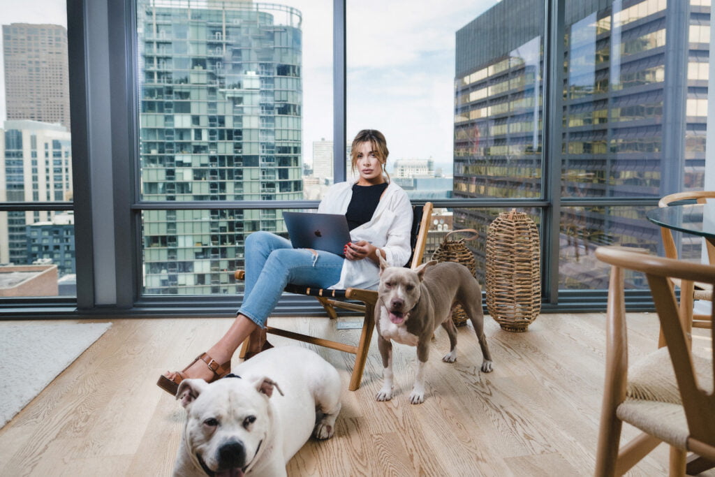 successful girl with her dogs in Chicago apartment